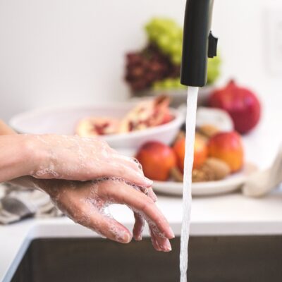 photo of person washing hands