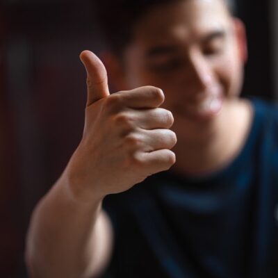 male with thumbs up